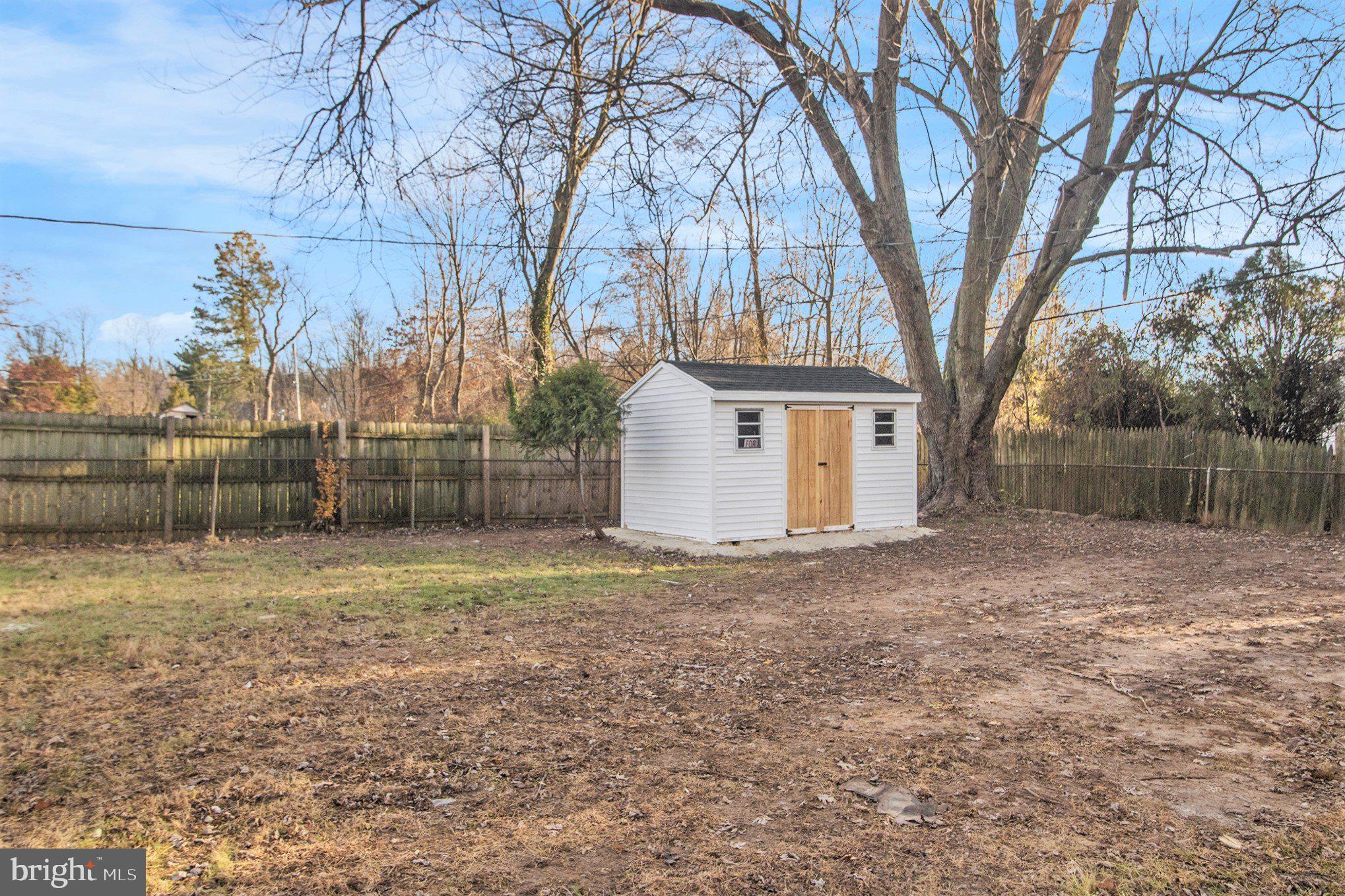 711 West County Line Road Hatboro, PA 19040 - Photo 37 of 40 a view of a house with a yard and garage