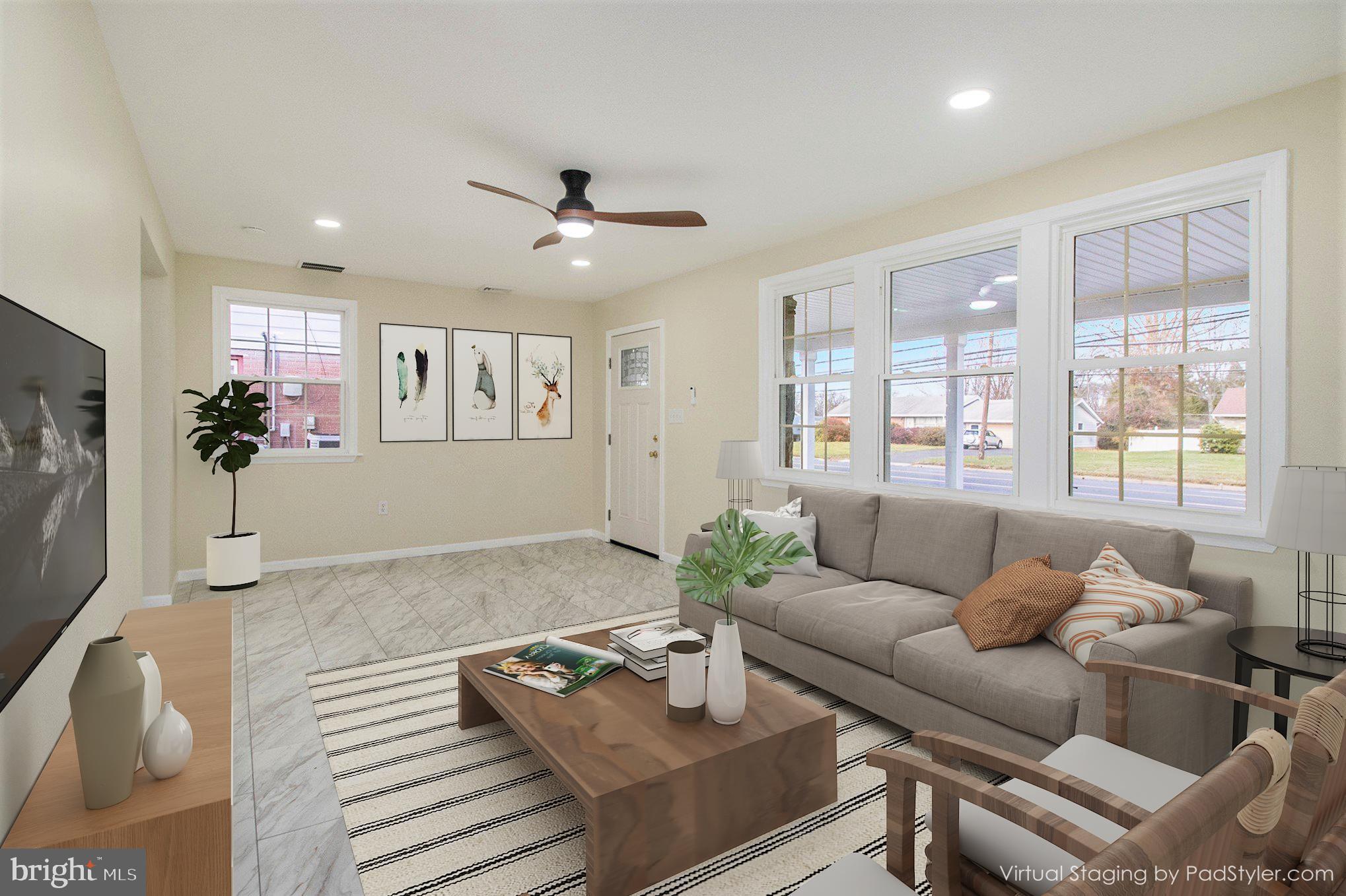 711 West County Line Road Hatboro, PA 19040 - Photo 10 of 40 a living room with furniture and a large window