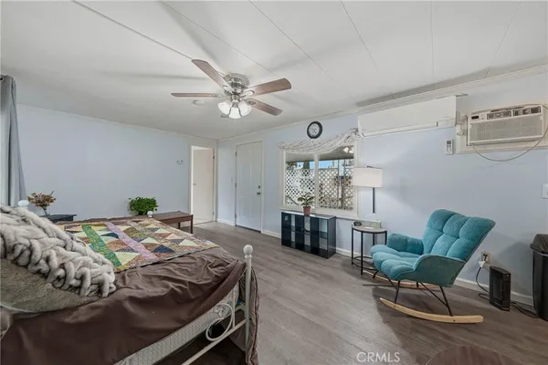 a bedroom with a bed and a table in it