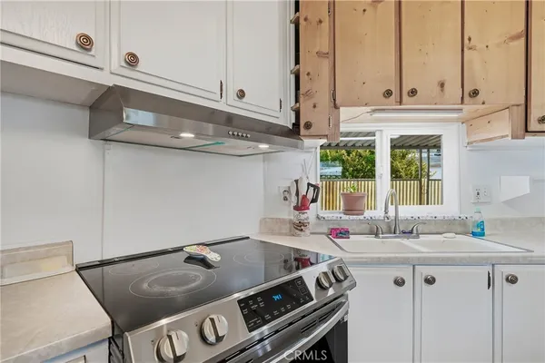 a living room with furniture and a chair