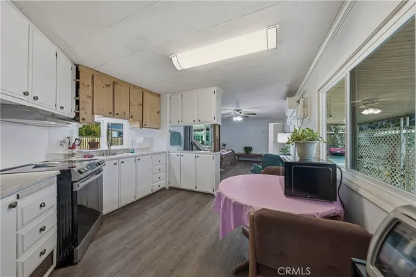 a bedroom with a bed and a large mirror