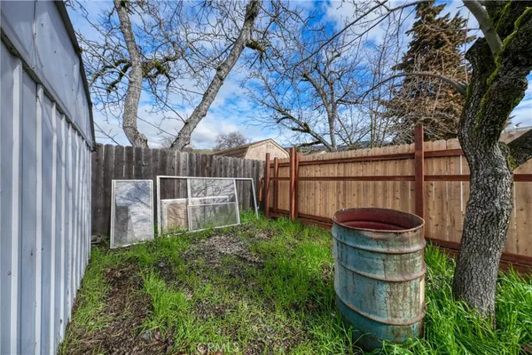 a backyard of a house with outdoor seating
