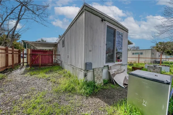 a view of backyard with sitting area