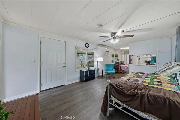 a bedroom with a bed and a table in it