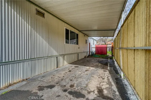 an aerial view of a house with garden space and lake view
