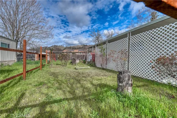 a view of a yard and front view of a house