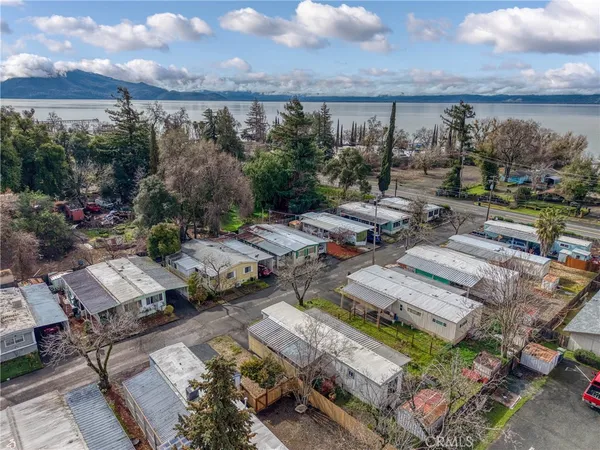 an aerial view of a house with a swimming pool yard and outdoor seating