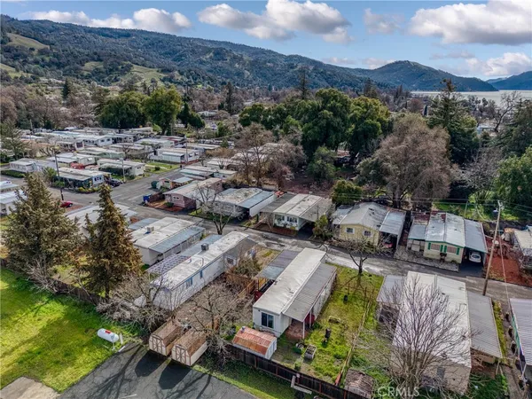 an aerial view of a house with a lake view
