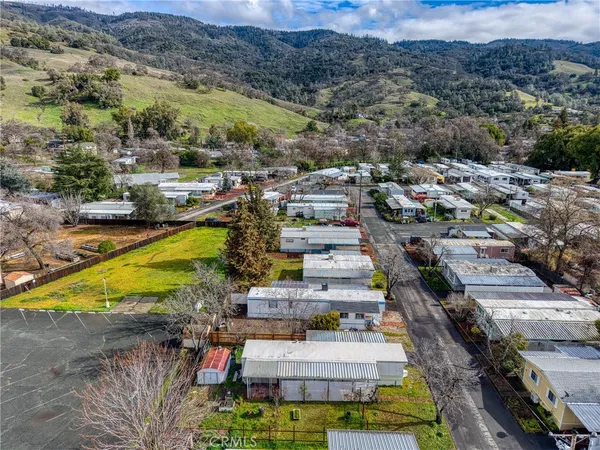 a aerial view of a house with swimming pool and sitting area