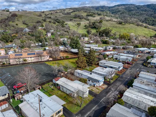 an aerial view of residential houses with outdoor space
