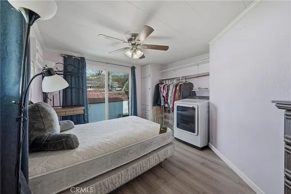 a bedroom with a bed next to a window with the outer view
