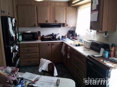 1080 Julie Lane, Unit 16 South Lake Tahoe, CA 96150 - Photo 9 of 13 a kitchen with a sink stove and refrigerator