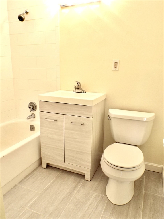 32 Juniper Street, Unit 98 Brookline, MA 02445 - Photo 11 of 17 a bathroom with a sink a toilet and bathtub