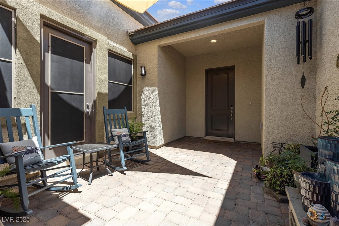 7072 Arabian Ridge Street Las Vegas, NV 89131 - Photo 11 of 30 Front courtyard, separate nextgen suite entrance