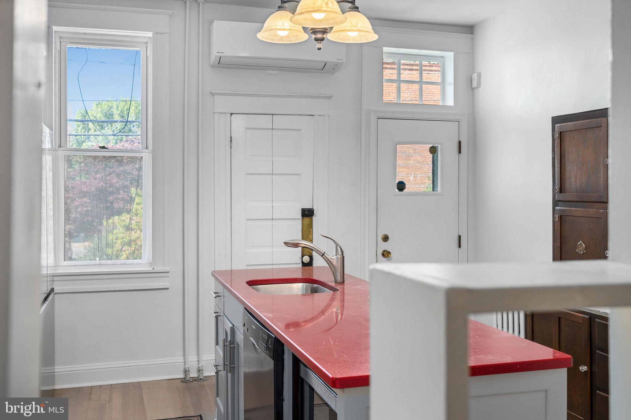 4148 Falls Road Baltimore, MD 21211 - Photo 14 of 37 a bathroom with a sink and a mirror