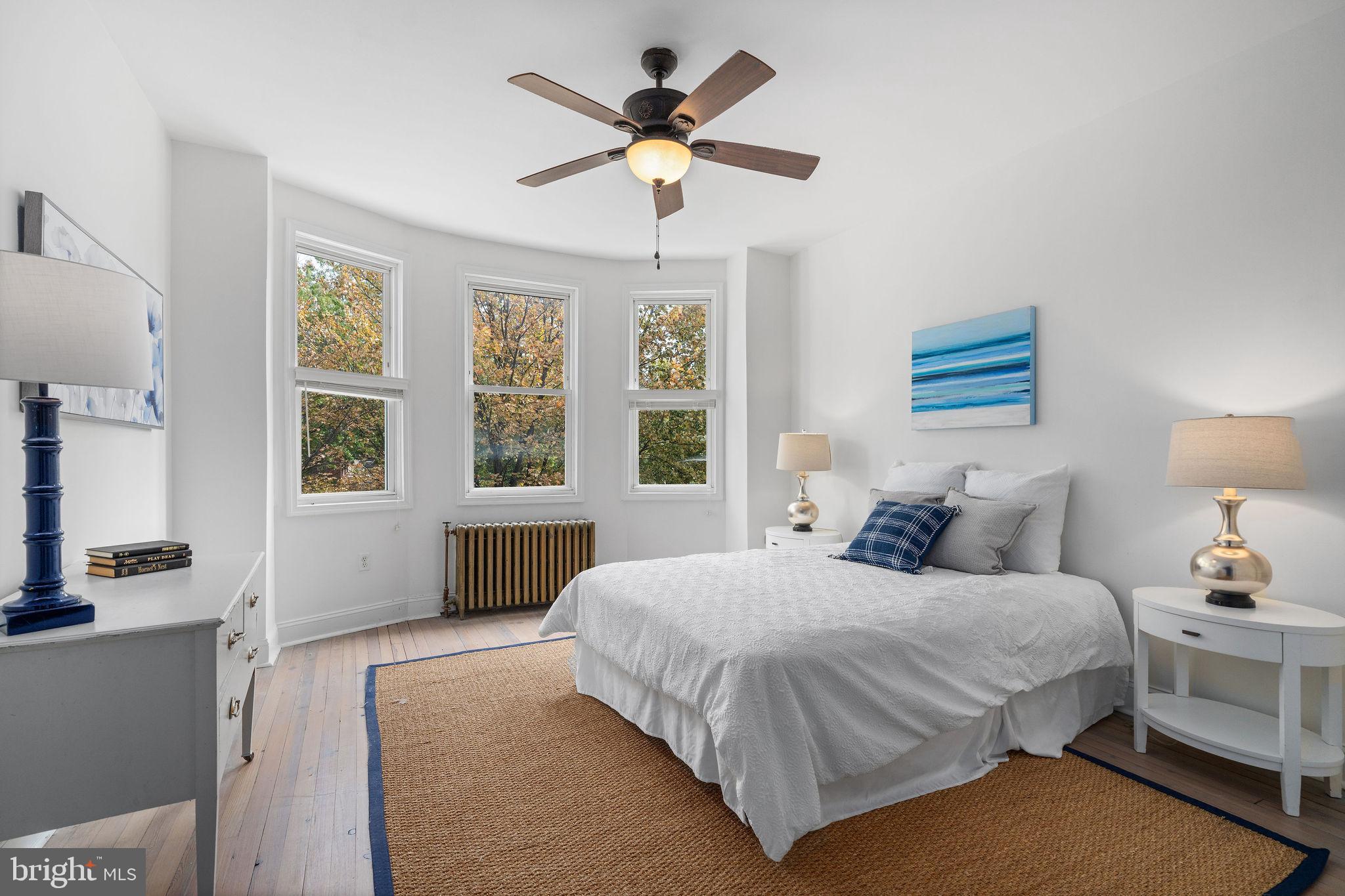 4148 Falls Road Baltimore, MD 21211 - Photo 20 of 37 a bedroom with a bed and window