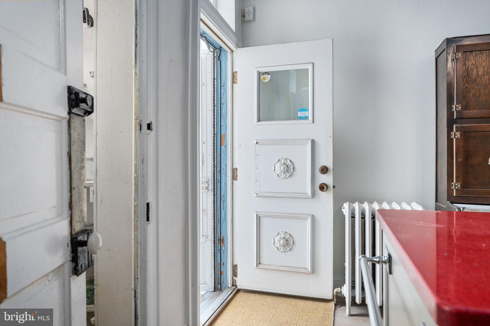 4148 Falls Road Baltimore, MD 21211 - Photo 32 of 37 a view of hallway with washer and dryer