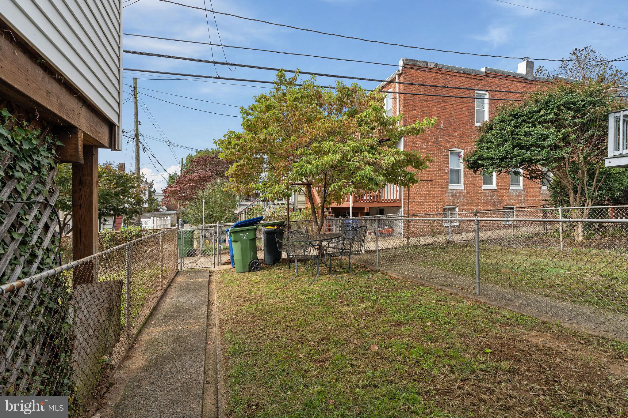 4148 Falls Road Baltimore, MD 21211 - Photo 33 of 37 a view of a backyard with plants and a patio