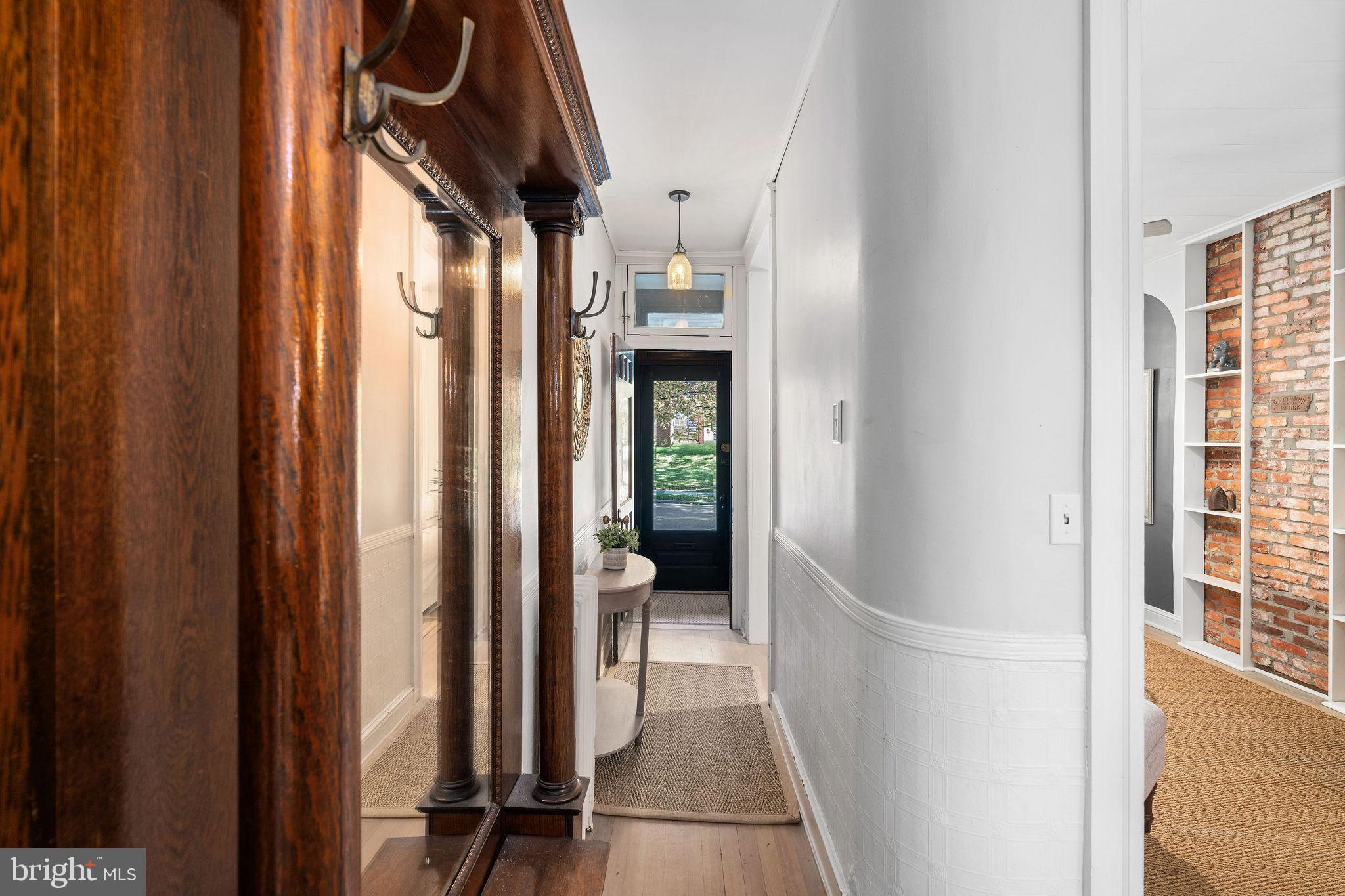 4148 Falls Road Baltimore, MD 21211 - Photo 5 of 37 a view of a hallway with wooden shelves