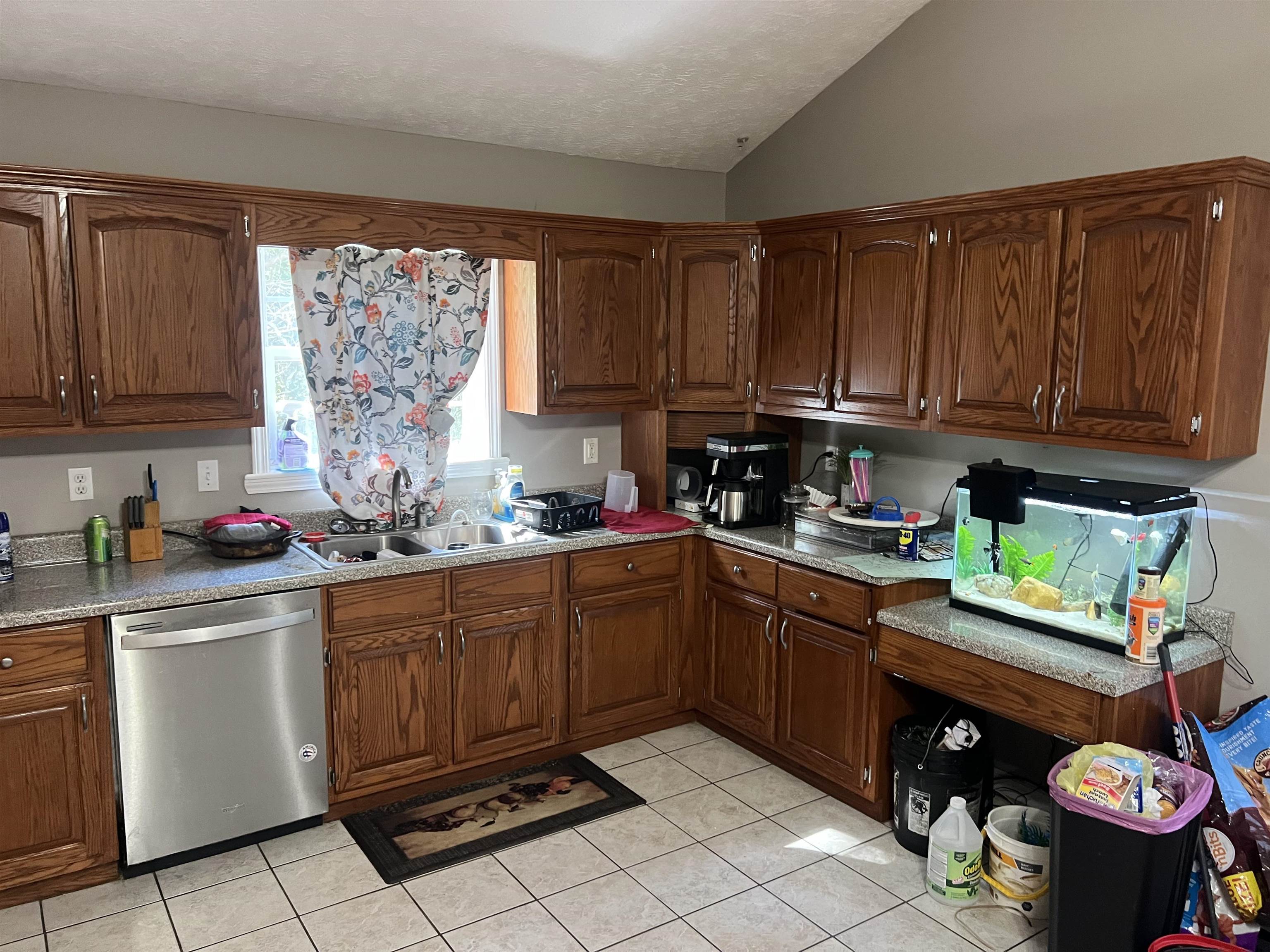 245 Drake Loop Savannah, TN 38372 - Photo 3 of 17 a kitchen with stainless steel appliances granite countertop a sink dishwasher stove and cabinets