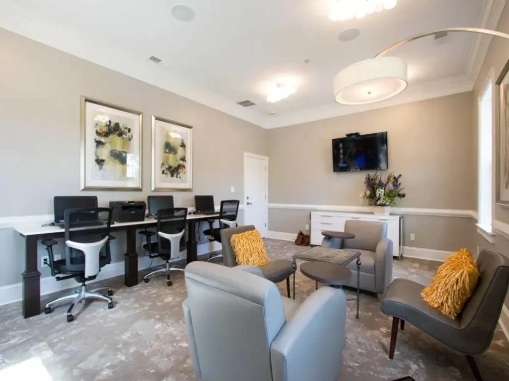 100 Crossing Boulevard, Unit 1301 McDonough, GA 30253 - Photo 18 of 26 a living room with furniture and a flat screen tv