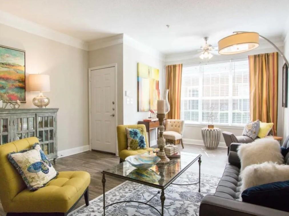 100 Crossing Boulevard, Unit 1301 McDonough, GA 30253 - Photo 5 of 26 a living room with furniture and a large window