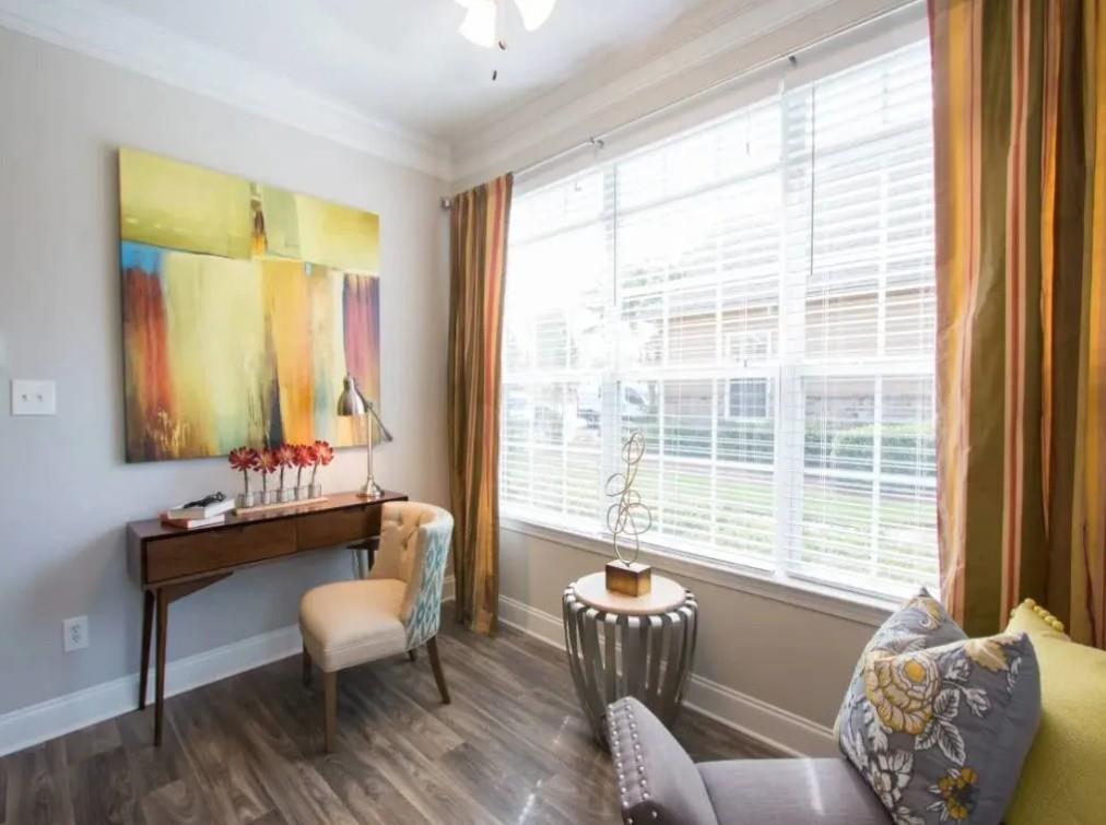 100 Crossing Boulevard, Unit 1301 McDonough, GA 30253 - Photo 7 of 26 a living room with furniture and a window