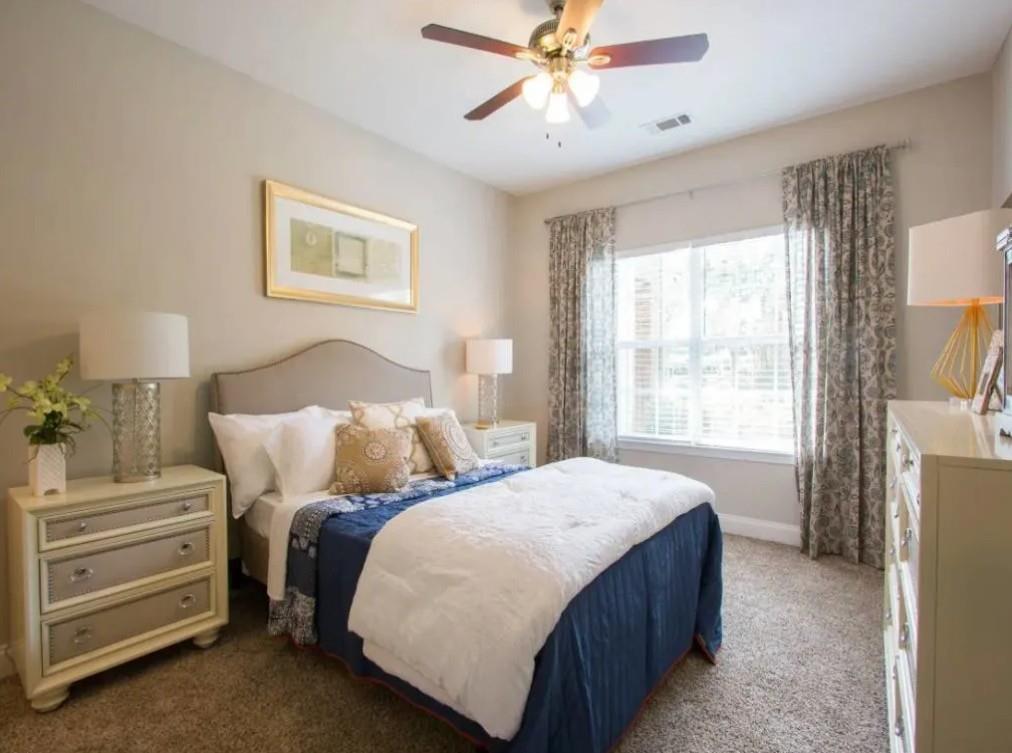 100 Crossing Boulevard, Unit 1301 McDonough, GA 30253 - Photo 9 of 26 a bedroom with double bed and a window