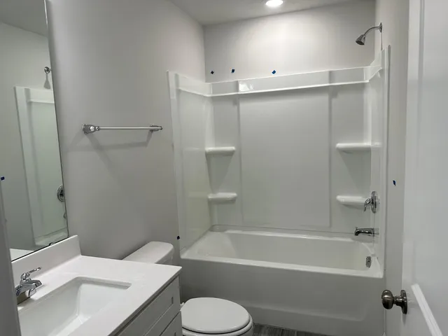 a bathroom with a sink toilet and bathtub