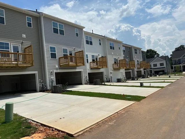 a front view of a building with retail shops