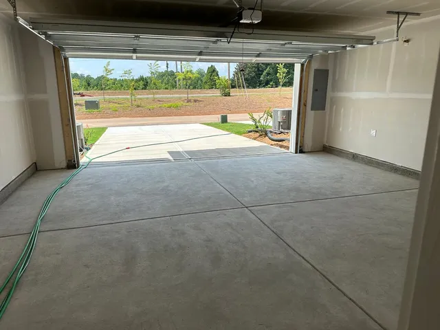 a view of a room with wooden floor and windows