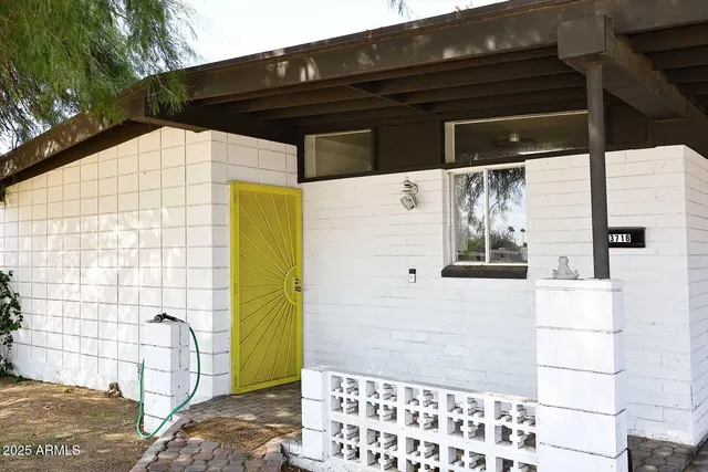 a black and white building with a outdoor space