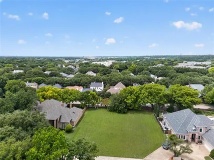 an aerial view of a house with a garden