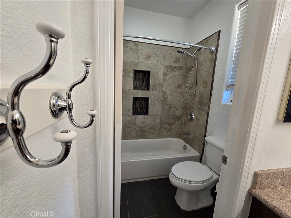 20329 Red Poppy Lane Riverside, CA 92508 - Photo 21 of 31 a bathroom with a toilet and a shower