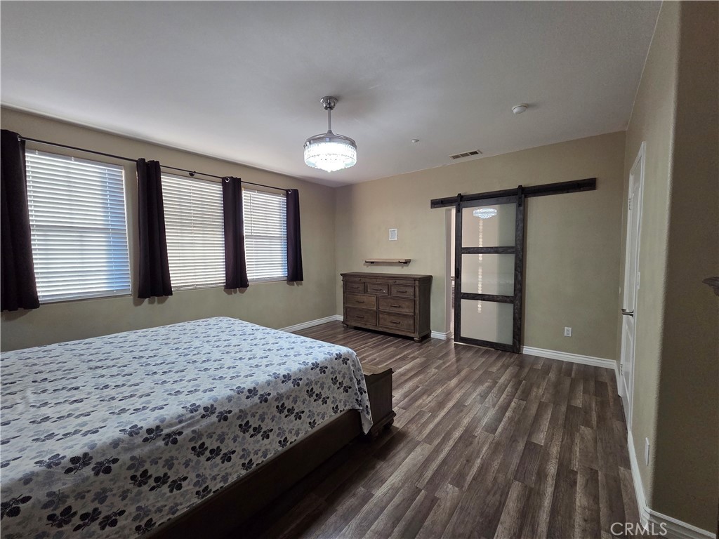 20329 Red Poppy Lane Riverside, CA 92508 - Photo 26 of 31 a bedroom with a bed and a dresser