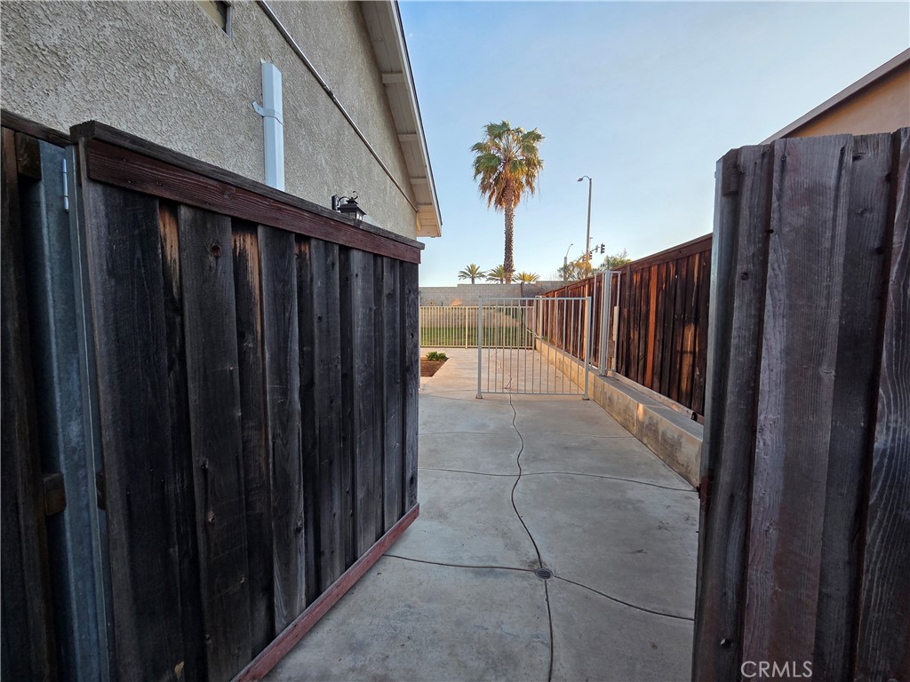 20329 Red Poppy Lane Riverside, CA 92508 - Photo 31 of 31 a view of a backyard with wooden fence