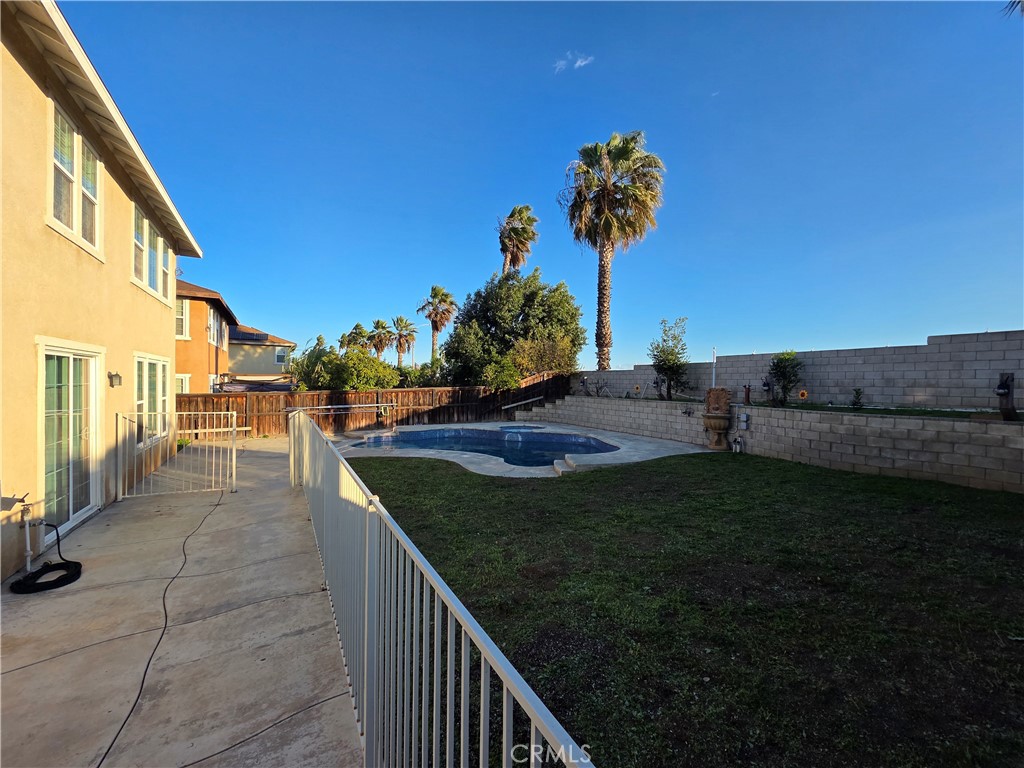 20329 Red Poppy Lane Riverside, CA 92508 - Photo 8 of 31 a view of a street with a building in the background