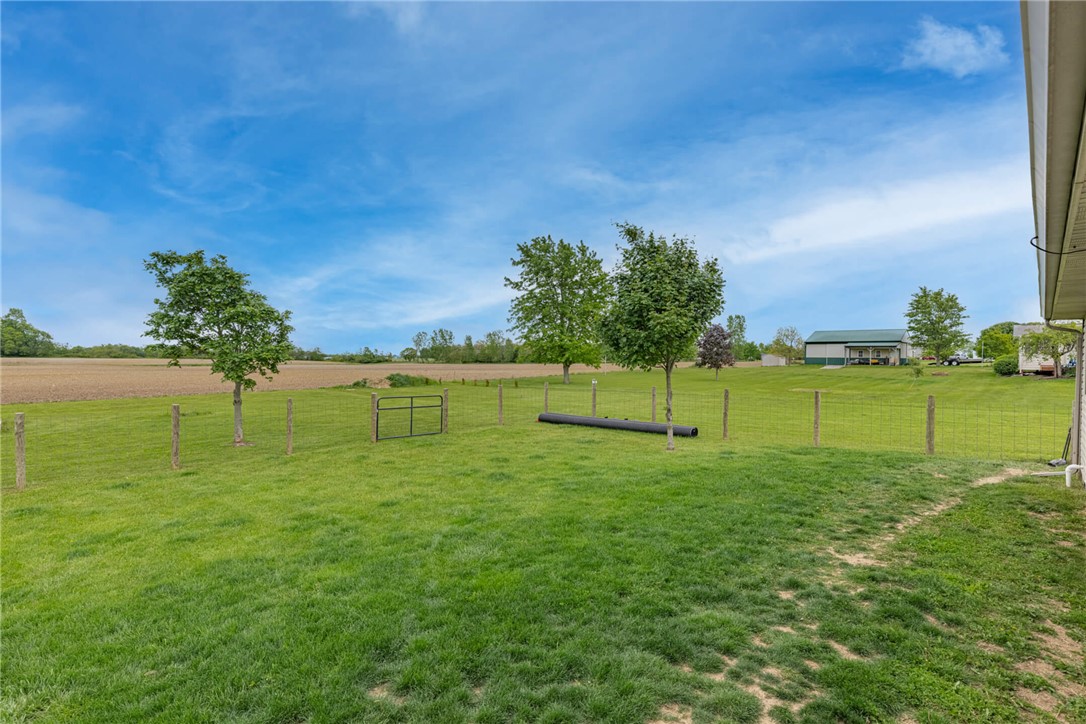 2645 Vance Road St. Paris, OH 43072 - Photo 28 of 35 Discover vast green spaces and peaceful rural views from this welcoming property.