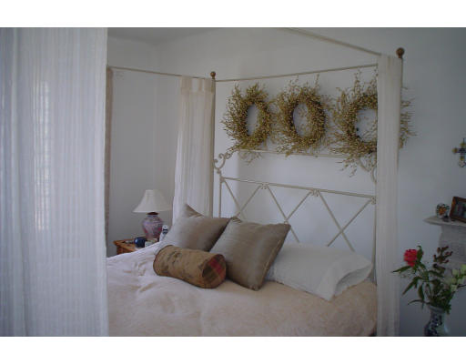 58 Greene Road Princeton, MA 01541 - Photo 9 of 17 a bedroom with a bed and a potted plant