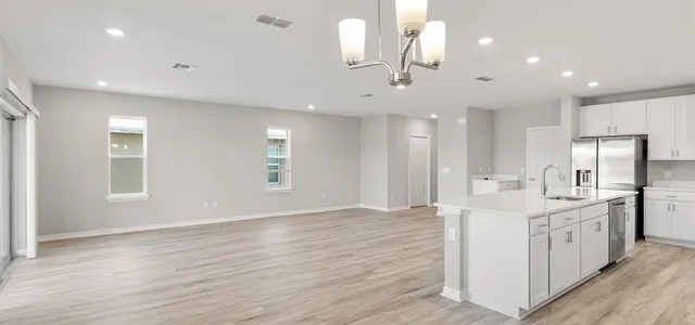 a view of kitchen with wooden floor