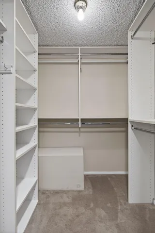 a bathroom with a tub shower and sink