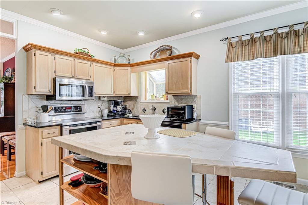 4326 Chilton Way High Point, NC 27265 - Photo 11 of 32 This home also features tiled kitchen island, perfect spot for casual meals!