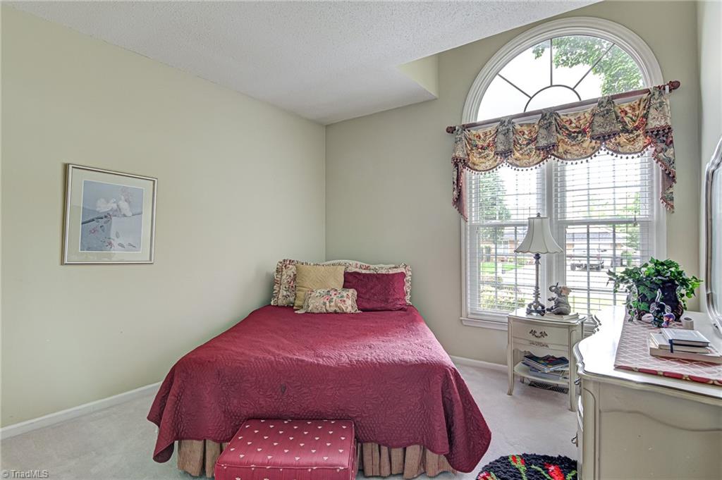 4326 Chilton Way High Point, NC 27265 - Photo 21 of 32 Second bedroom features arched window to provide lots of natural light!