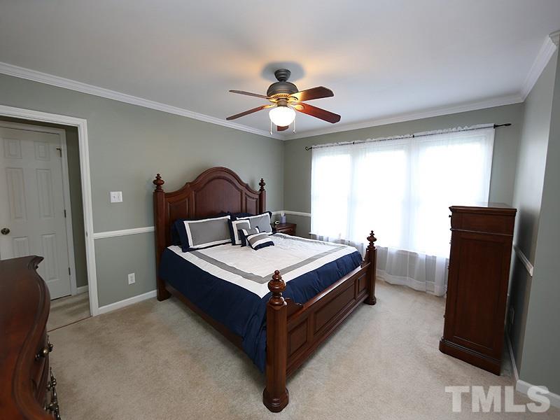 1012 Christy Ridge Court Rougemont, NC 27572 - Photo 14 of 20 a room with a bed and a chandelier