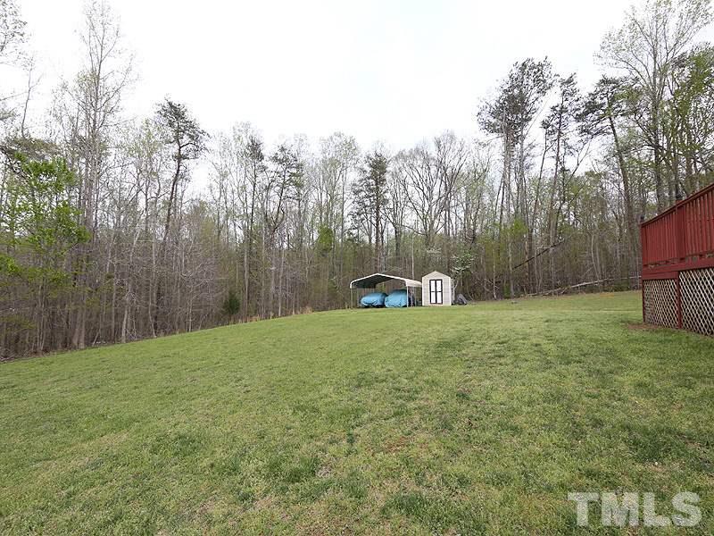 1012 Christy Ridge Court Rougemont, NC 27572 - Photo 19 of 20 a backyard of a house with lots of green space