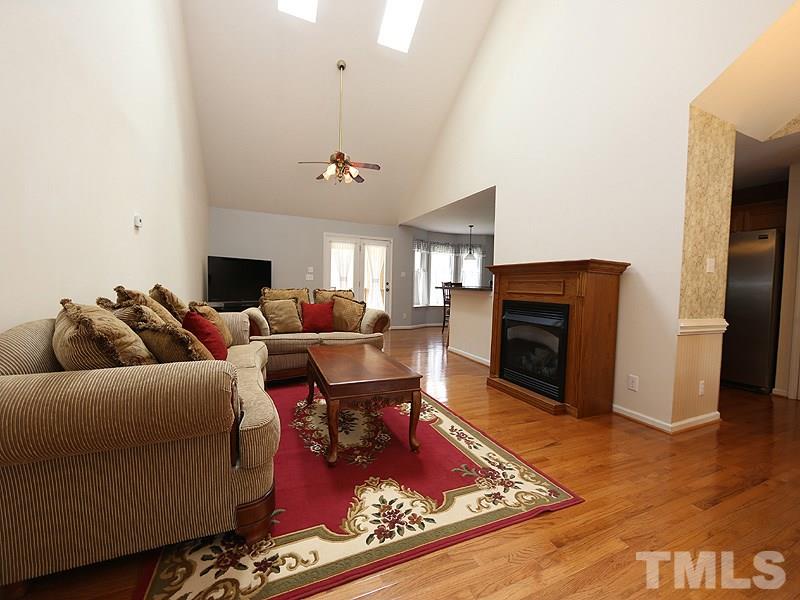 1012 Christy Ridge Court Rougemont, NC 27572 - Photo 4 of 20 a living room with furniture a fireplace and a flat screen tv