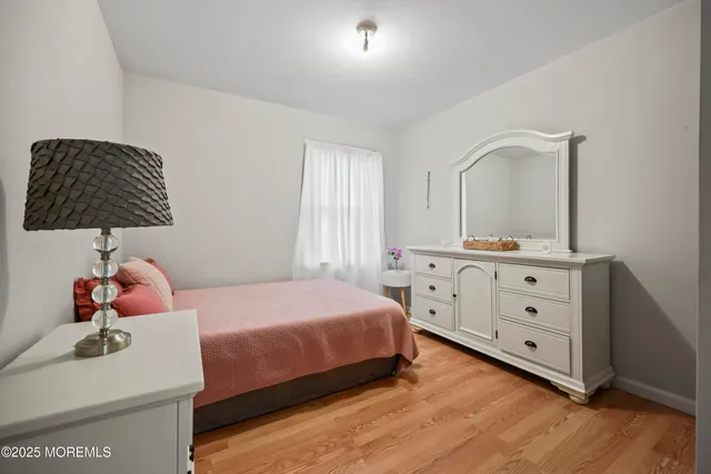 a bedroom with a bed and a dresser