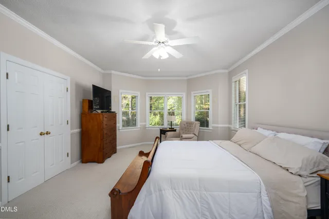 a bed room with a bed and a chandelier