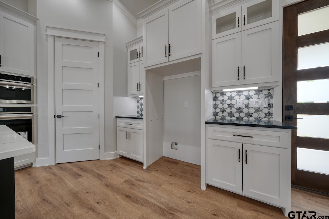 19383 Ridge Point Circle Lindale, TX 75771 - Photo 11 of 48 wooden floor with cabinet and window
