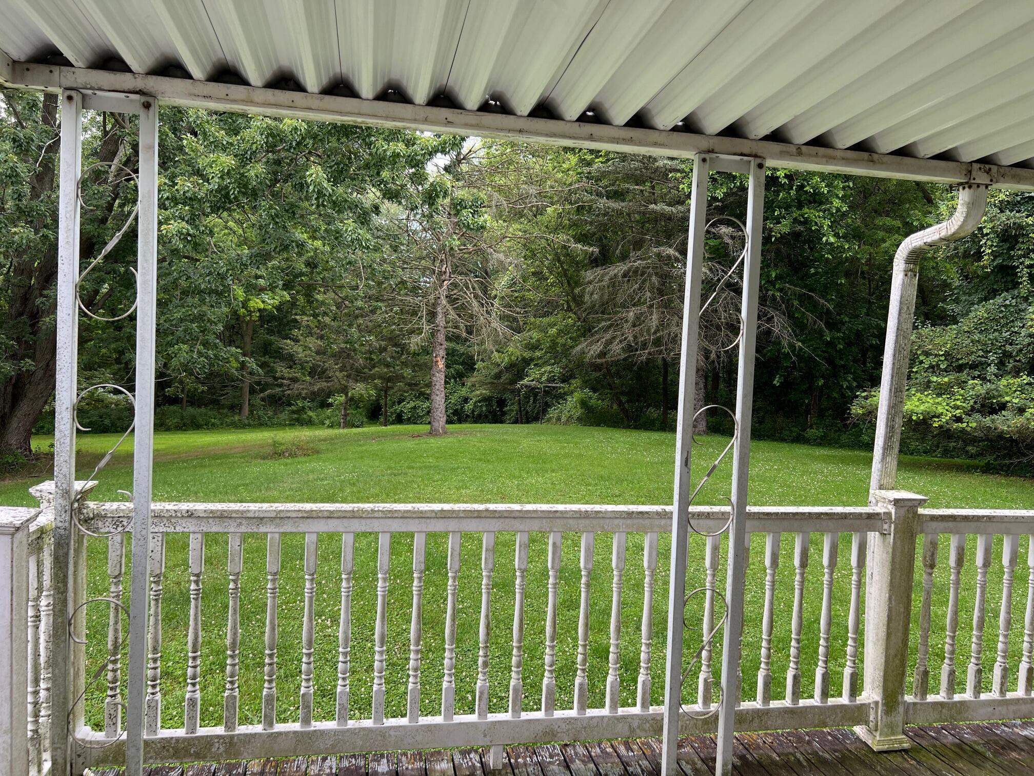 15306 Peacock Road Haslett, MI 48840 - Photo 22 of 34 Covered deck